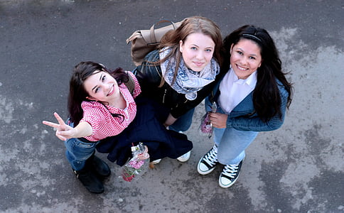 aerial photography of three smiling women during daytime thumbnail
