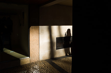 silhouette of woman smoking cigarette thumbnail