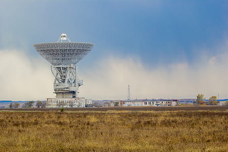 architectural photography of gray satellite transmission building thumbnail