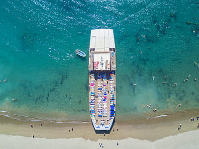 aerial view of cruiser ship beside seashore thumbnail