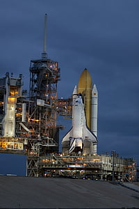 white and brown rocket on launching pad thumbnail