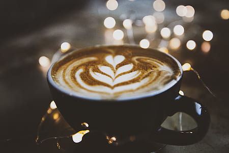 capuccino in black ceramic teacup selective focus photography thumbnail