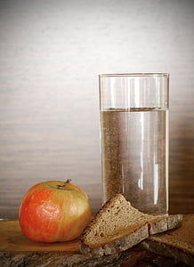 clear drinking glass beside red apple thumbnail