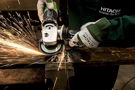 person using angle grinder on steel thumbnail