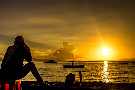 silhouette of person fronting body of water thumbnail