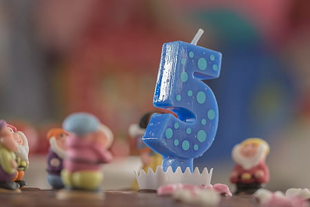 closeup photography of blue 5 cake candle thumbnail