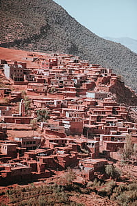 town on hill during daytime thumbnail