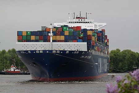 blue and red cargo ship on sea thumbnail