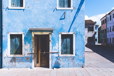 blue and white painted house taken at daytime thumbnail