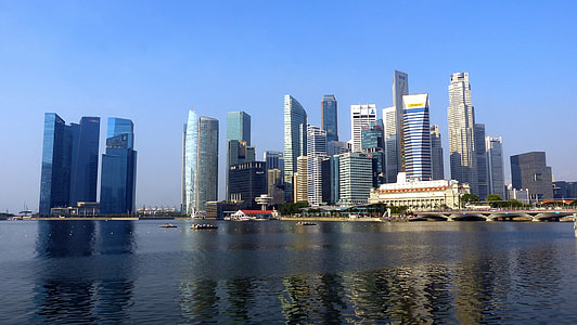city buildings near on body of water thumbnail