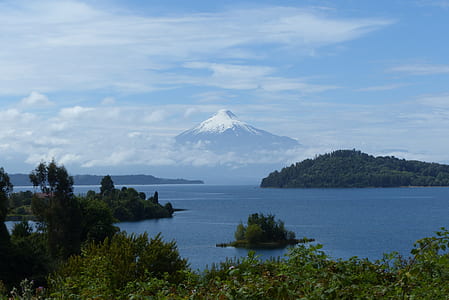 mountain near body of water at daytime thumbnail