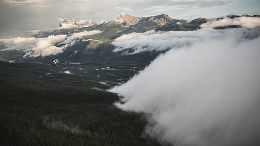 white clouds over mountains thumbnail