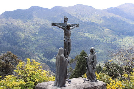 Jesus Christ statue near mountain during day time thumbnail