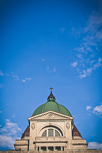 white, brown and green concrete church during daytime thumbnail