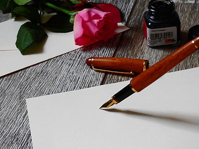 red and black fountain pen on white printer paper thumbnail