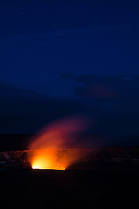 lighted fire on hole during night time thumbnail