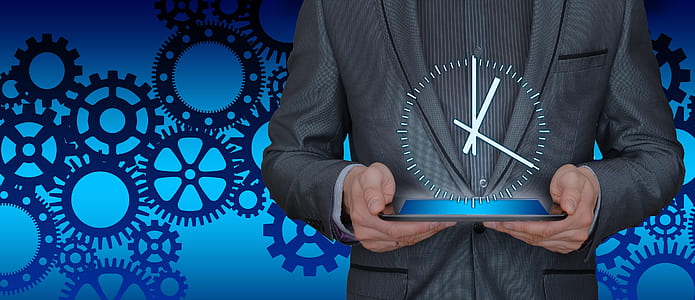 person holding blue base clock thumbnail