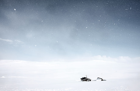 house surrounded by snow thumbnail