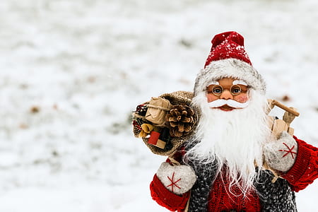 selective focus photography of Santa Claus figurine thumbnail