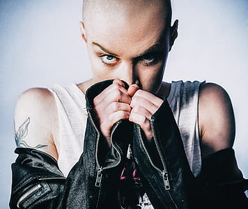 woman in white tank top and black leather jacket thumbnail
