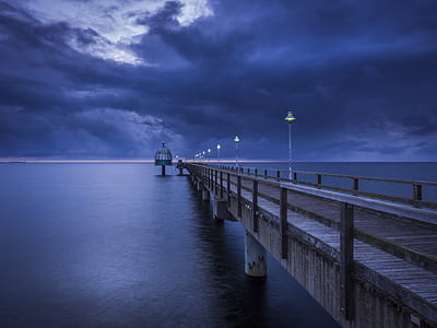 photo of lighted post lamp on wooden dock thumbnail