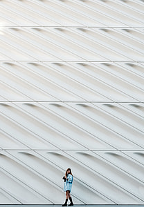 man standing beside wall thumbnail