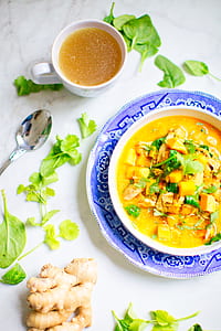 white teacup beside gray spoon thumbnail