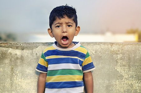 boy in blue and white shirt thumbnail