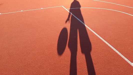 silhouette of person dribbling a ball thumbnail