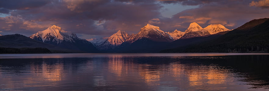 landscape photography of body of water in front snow field mountaings thumbnail