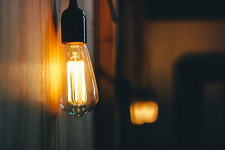 turned-on clear Edison light bulb thumbnail