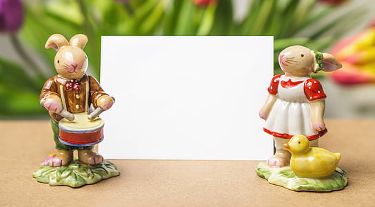 two male and female rabbit figurines near white card thumbnail