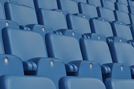selective focus photography of blue leather chairs thumbnail