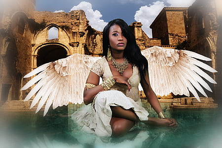 woman wearing white dress and wings thumbnail