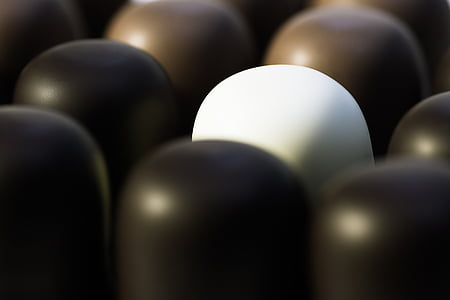 sphere white ornament near black components thumbnail