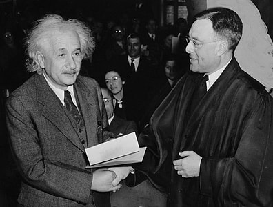 Albert Einstein shaking hand person thumbnail