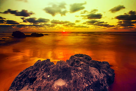black rock formation during sunset thumbnail