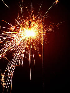 lighted firecracker at night time thumbnail