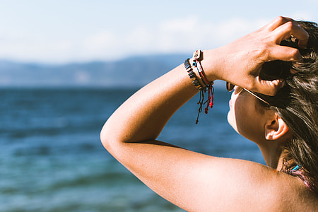 woman holding her hair during sunrise thumbnail