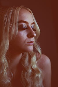 woman closing her eyes at dark place thumbnail