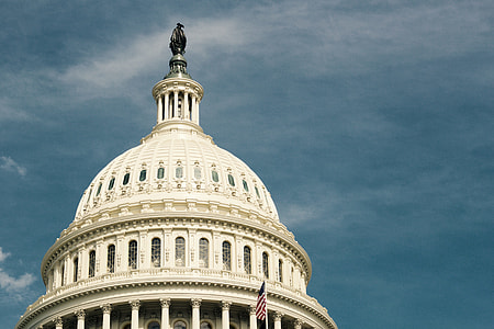 Capitol building under blue sky thumbnail