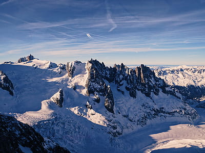 snow covered mountain during daytime thumbnail