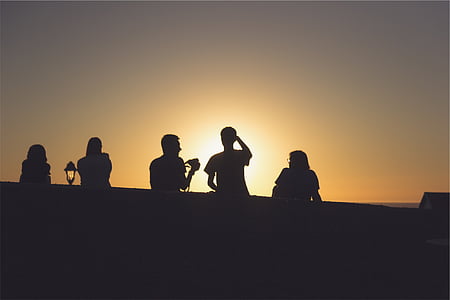 silhouette group of people under sunset thumbnail