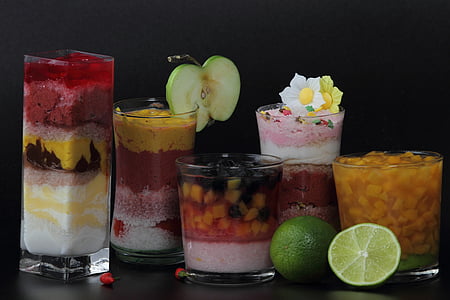 five assorted deserts on clear glass cups thumbnail