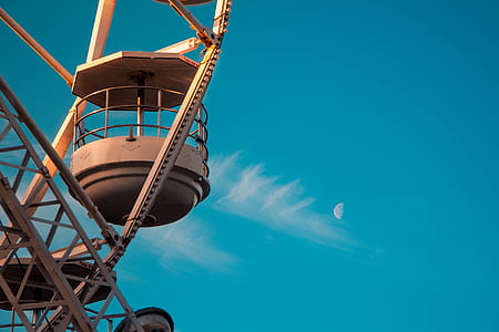 gray and brown heavy equipment under blue sky thumbnail