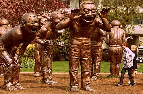 bronze-colored statues during daytime thumbnail