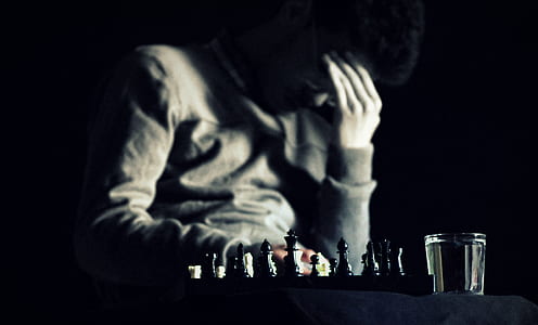man playing chess game thumbnail