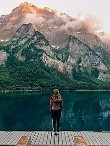 Woman Standing on Brown Wooden Plank thumbnail