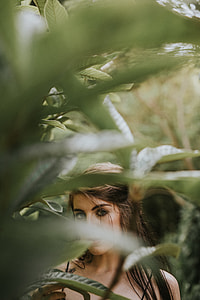 portrait of woman with green leaves thumbnail