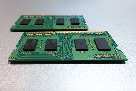 two green RAM sticks on white surface thumbnail